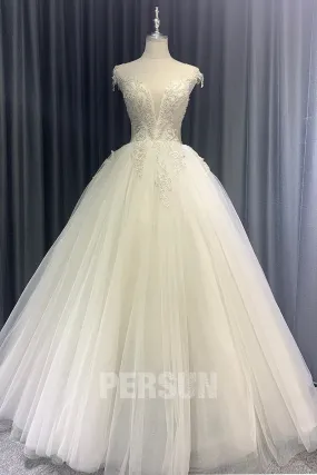 Robe mariée spectaculaire décolleté V plongeant orné de bijoux dos découpé